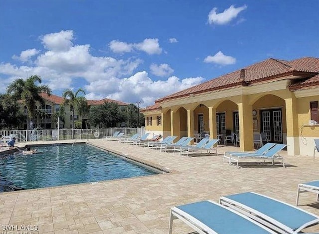 4135 Residence Dr Unit 618, Fort Myers, FL 33901 - community pool featuring a patio