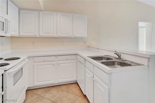 4135 Residence Dr Unit 618, Fort Myers, FL 33901 - kitchen featuring white appliances, light tile patterned floors, a peninsula, and white cabinetry