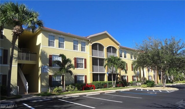 4135 Residence Dr Unit 618, Fort Myers, FL 33901 - view of building exterior featuring uncovered parking