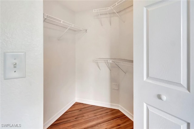 4135 Residence Dr Unit 618, Fort Myers, FL 33901 - walk in closet featuring wood finished floors