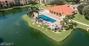 4135 Residence Dr Unit 618, Fort Myers, FL 33901 - drone / aerial view of a pool and a nearby body of water