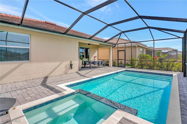 2131 Hamlin St, Naples, FL 34120 - view of pool featuring a patio area, ceiling fan, a pool with connected hot tub, and glass enclosure