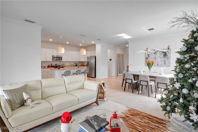 2131 Hamlin St, Naples, FL 34120 - living area with crown molding, light tile patterned floors, and recessed lighting