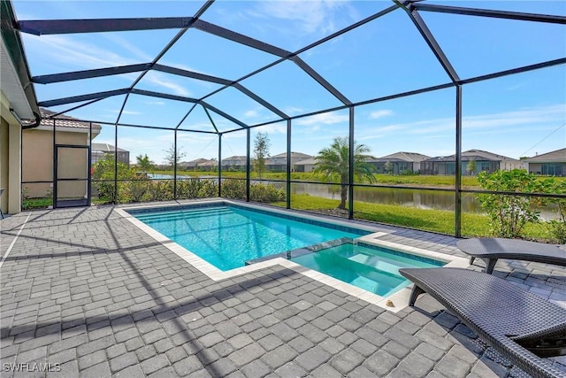 2131 Hamlin St, Naples, FL 34120 - view of pool with a patio, a water view, a pool with connected hot tub, a residential view, and glass enclosure