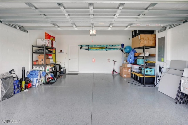 2131 Hamlin St, Naples, FL 34120 - garage featuring a garage door opener and electric panel