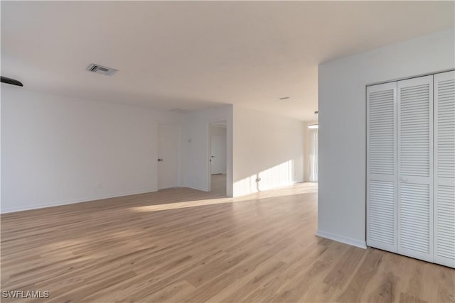3091 52nd St SW, Naples, FL 34116 - unfurnished living room featuring light wood finished floors and baseboards