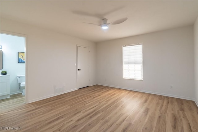 3091 52nd St SW, Naples, FL 34116 - unfurnished bedroom featuring light wood-style floors, baseboards, connected bathroom, and ceiling fan