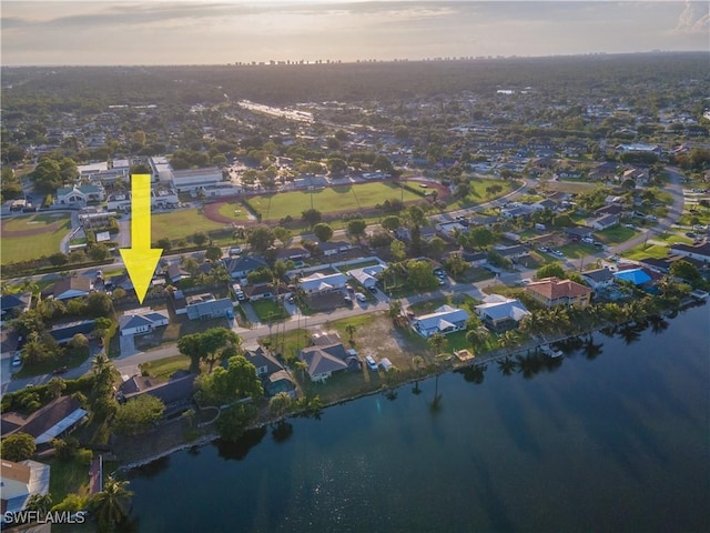 3091 52nd St SW, Naples, FL 34116 - aerial view at dusk of a water view and a residential view