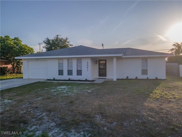 3091 52nd St SW, Naples, FL 34116 - ranch-style home with stucco siding, an attached garage, concrete driveway, and a front lawn
