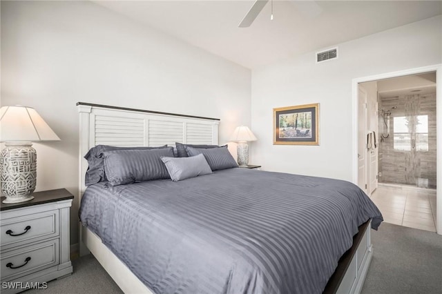 23581 Sandycreek Ter Unit 1107, Estero, FL 34135 - bedroom with light colored carpet, ensuite bathroom, and ceiling fan