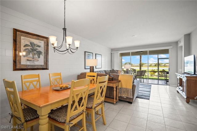 23581 Sandycreek Ter Unit 1107, Estero, FL 34135 - dining space with a chandelier and light tile patterned flooring