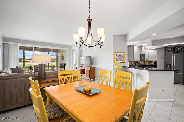 23581 Sandycreek Ter Unit 1107, Estero, FL 34135 - dining space featuring light tile patterned floors, a chandelier, and recessed lighting