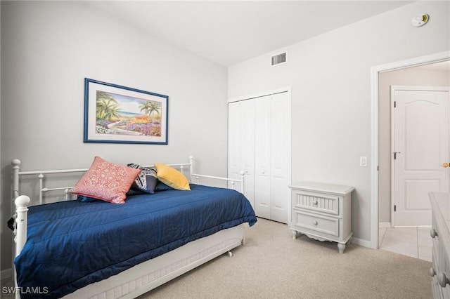 23581 Sandycreek Ter Unit 1107, Estero, FL 34135 - bedroom featuring light colored carpet, a closet, and baseboards