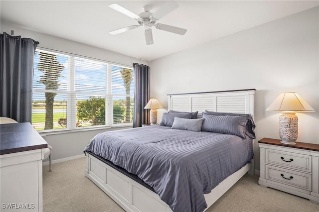 23581 Sandycreek Ter Unit 1107, Estero, FL 34135 - bedroom featuring light carpet, baseboards, and ceiling fan