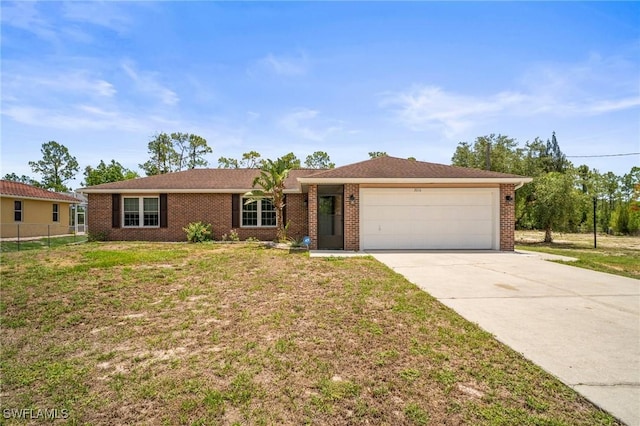 2016 Fitch Ave, Alva, FL 33920 - ranch-style house with an attached garage, driveway, and brick siding