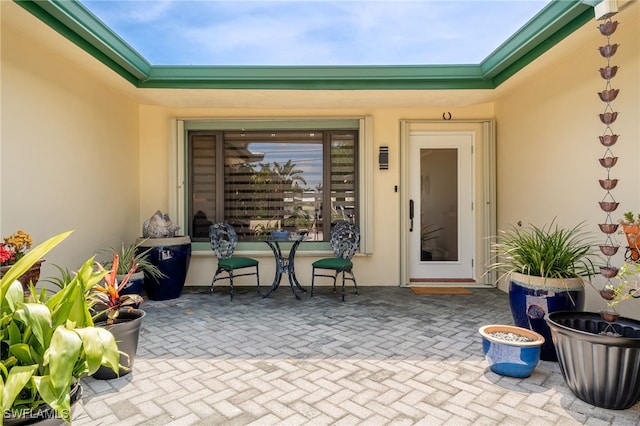 155 Donna Ct, Punta Gorda, FL 33950 - view of exterior entry with stucco siding and a patio area