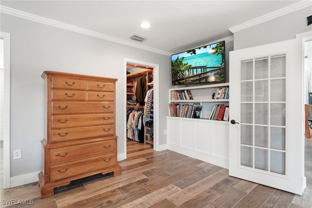 155 Donna Ct, Punta Gorda, FL 33950 - bedroom with ornamental molding, a spacious closet, wood finished floors, a closet, and recessed lighting