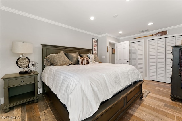 155 Donna Ct, Punta Gorda, FL 33950 - bedroom with ornamental molding, wood finished floors, recessed lighting, and two closets