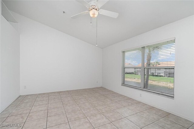 5135 Cobble Creek Ct Unit 204, Naples, FL 34110 - spare room with vaulted ceiling, ceiling fan, and light tile patterned floors