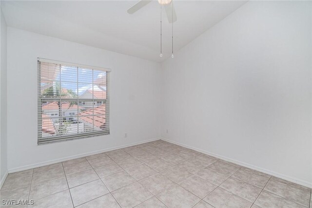 5135 Cobble Creek Ct Unit 204, Naples, FL 34110 - unfurnished room featuring light tile patterned flooring, a ceiling fan, and baseboards