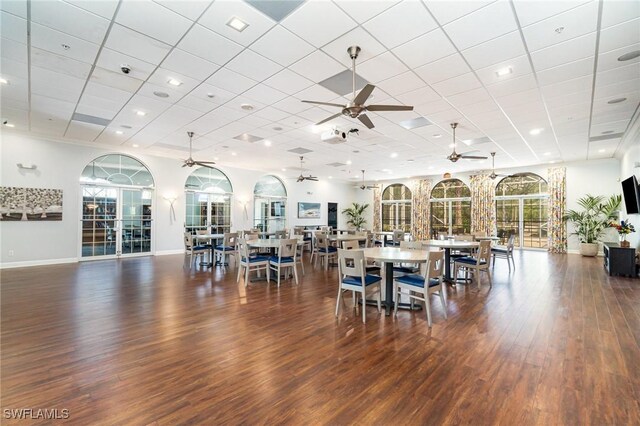 5135 Cobble Creek Ct Unit 204, Naples, FL 34110 - dining room featuring ceiling fan, wood finished floors, baseboards, and a drop ceiling