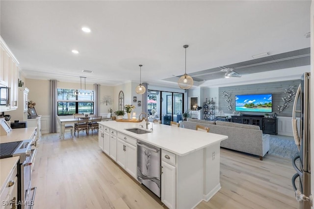 17476 Ashcomb Way, Estero, FL 33928 - kitchen with stainless steel appliances, light wood-style flooring, white cabinetry, recessed lighting, and light countertops