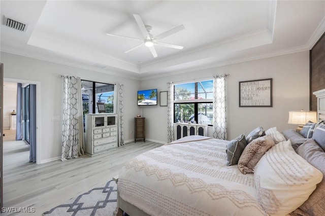 17476 Ashcomb Way, Estero, FL 33928 - bedroom featuring a raised ceiling, light wood finished floors, ornamental molding, and a ceiling fan