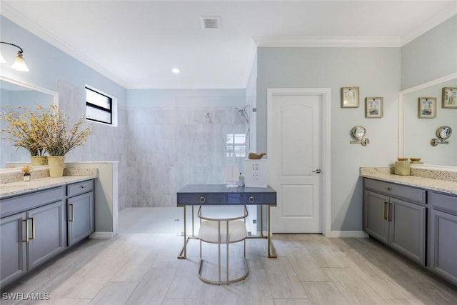 17476 Ashcomb Way, Estero, FL 33928 - bathroom with walk in shower, vanity, ornamental molding, and wood finished floors