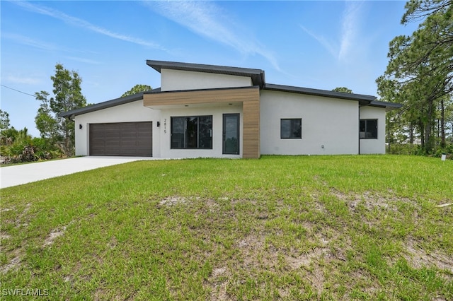 2815 45th St W, Lehigh Acres, FL 33971 - view of front of property featuring stucco siding, a garage, a front lawn, and driveway