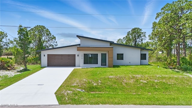 2815 45th St W, Lehigh Acres, FL 33971 - contemporary house featuring stucco siding, concrete driveway, an attached garage, and a front yard