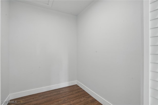 2815 45th St W, Lehigh Acres, FL 33971 - empty room featuring baseboards, dark wood-style flooring, and built in features