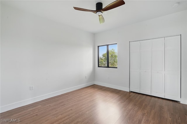 2815 45th St W, Lehigh Acres, FL 33971 - unfurnished bedroom featuring wood finished floors, baseboards, a closet, and ceiling fan