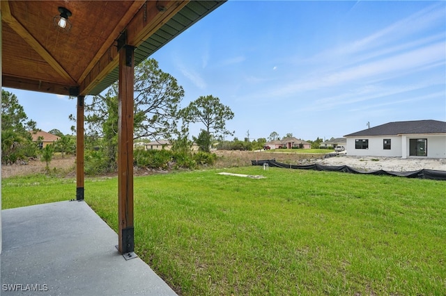 2815 45th St W, Lehigh Acres, FL 33971 - view of green lawn featuring a patio