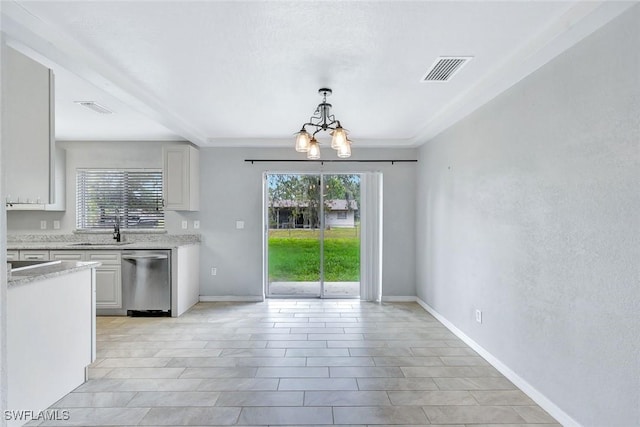13820 2nd St, Fort Myers, FL 33905 - kitchen featuring dishwasher, a chandelier, a sink, hanging light fixtures, and baseboards