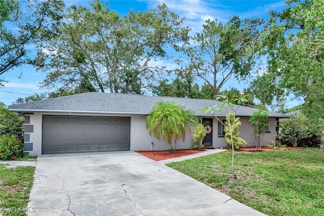 13820 2nd St, Fort Myers, FL 33905 - ranch-style house featuring an attached garage, concrete driveway, stucco siding, and a front yard