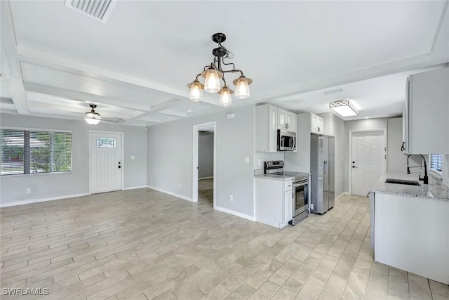 13820 2nd St, Fort Myers, FL 33905 - kitchen with appliances with stainless steel finishes, a sink, baseboards, beam ceiling, and coffered ceiling