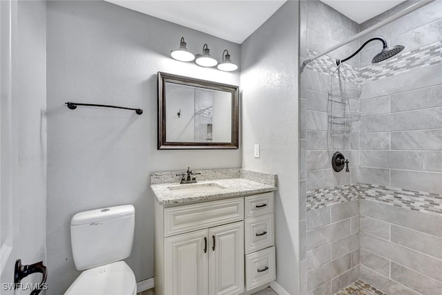 13820 2nd St, Fort Myers, FL 33905 - bathroom featuring a tile shower, vanity, and toilet