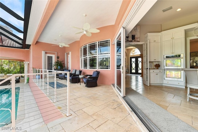 4409 Crews Ct, Port Charlotte, FL 33952 - view of patio with french doors, ceiling fan, and an outdoor pool