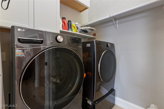 4409 Crews Ct, Port Charlotte, FL 33952 - washroom featuring washer and clothes dryer, baseboards, and cabinet space