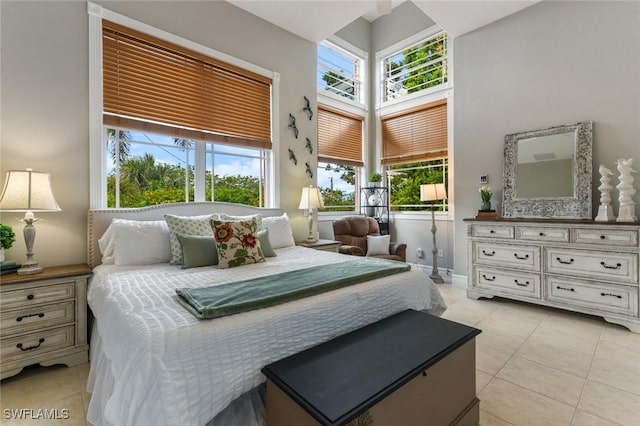4409 Crews Ct, Port Charlotte, FL 33952 - bedroom with multiple windows, light tile patterned flooring, and a towering ceiling