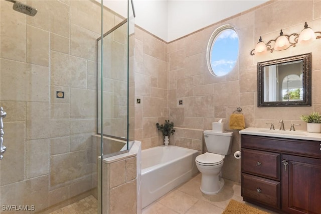 4409 Crews Ct, Port Charlotte, FL 33952 - bathroom with vanity, a bath, a stall shower, tile walls, and toilet