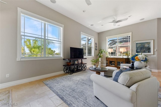 4409 Crews Ct, Port Charlotte, FL 33952 - living room featuring a ceiling fan and baseboards