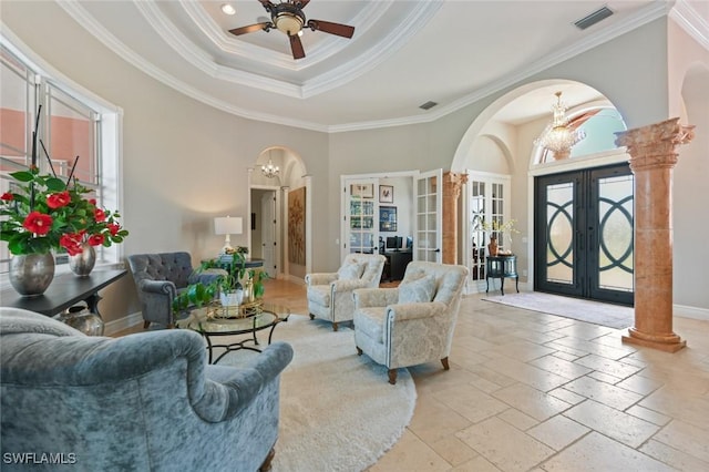 4409 Crews Ct, Port Charlotte, FL 33952 - living area featuring french doors, arched walkways, a chandelier, healthy amount of natural light, and crown molding