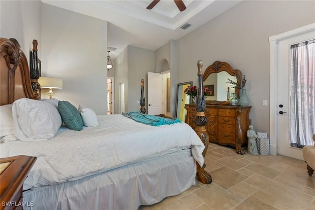 4409 Crews Ct, Port Charlotte, FL 33952 - bedroom featuring stone finish floors, a ceiling fan, and a tray ceiling