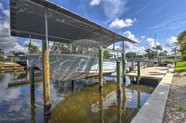4409 Crews Ct, Port Charlotte, FL 33952 - dock featuring boat lift and a water view