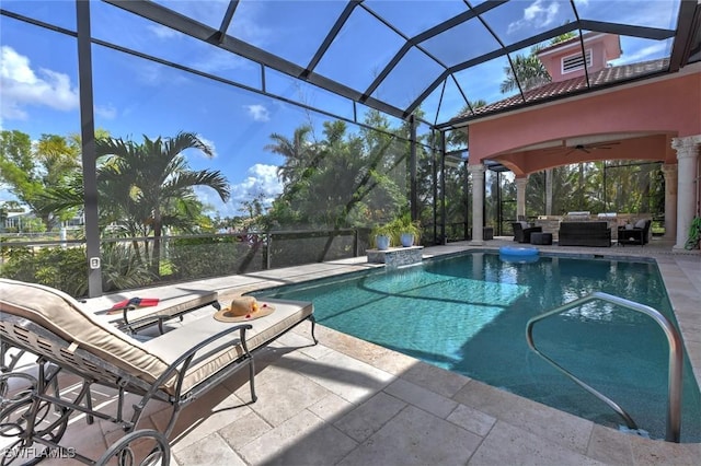 4409 Crews Ct, Port Charlotte, FL 33952 - outdoor pool featuring an outdoor hangout area, a patio area, ceiling fan, and glass enclosure