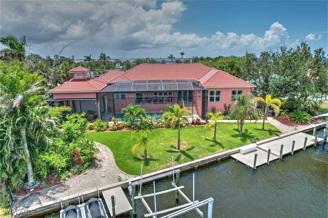 4409 Crews Ct, Port Charlotte, FL 33952 - rear view of property featuring a tiled roof, boat lift, a water view, and a lanai