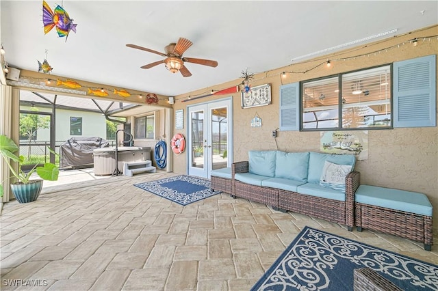 1826 SE 6th Ave, Cape Coral, FL 33990 - view of patio with french doors, a hot tub, ceiling fan, and an outdoor hangout area