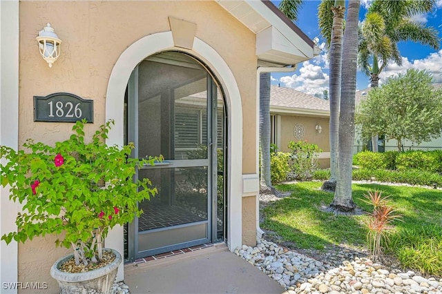 1826 SE 6th Ave, Cape Coral, FL 33990 - view of exterior entry with stucco siding