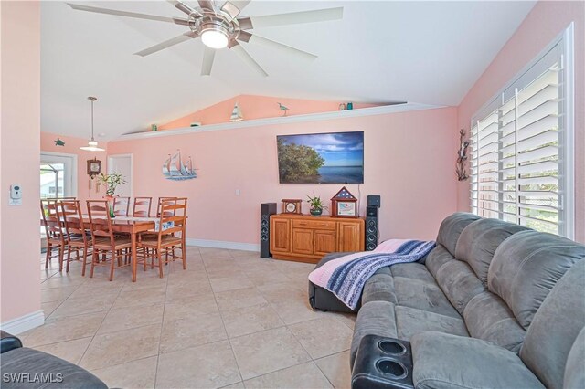 1826 SE 6th Ave, Cape Coral, FL 33990 - living area featuring lofted ceiling, a ceiling fan, light tile patterned flooring, and baseboards